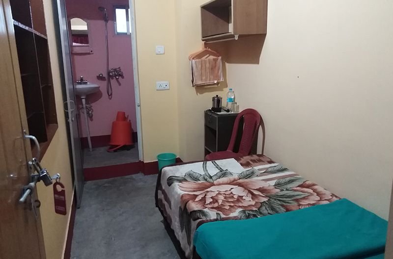 Budget room with a single bed and separate bathroom